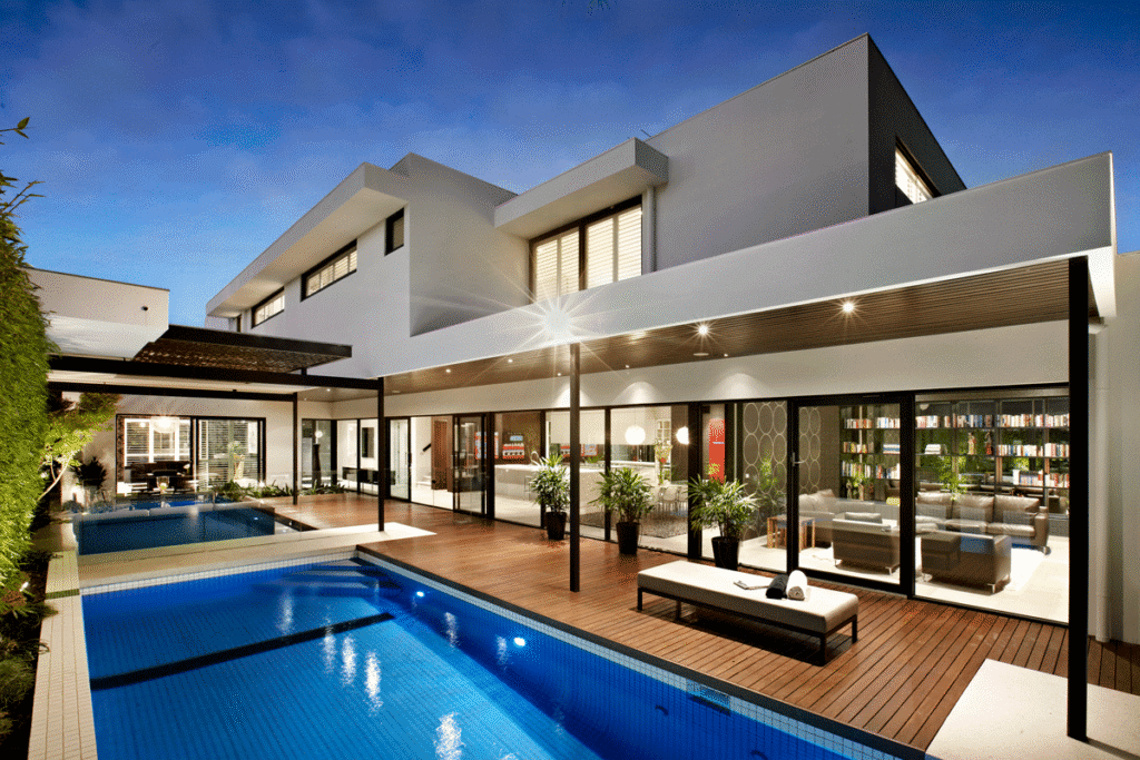 Modern outdoor patio with large-format concrete pavers and built-in fire pit | Exquisite Lawn & Landscaping
